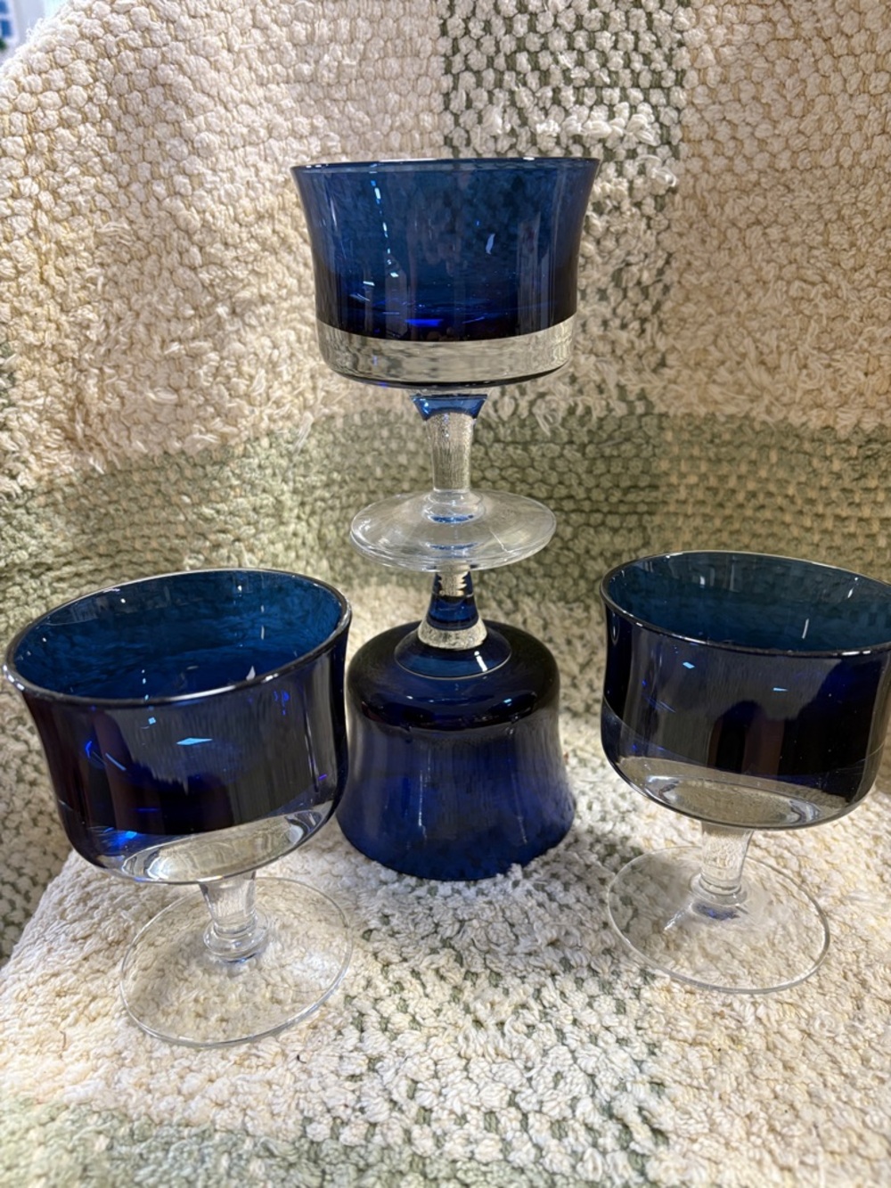 Denby Mirage Blue champagne glasses or tall sherbet glasses with clear stems.